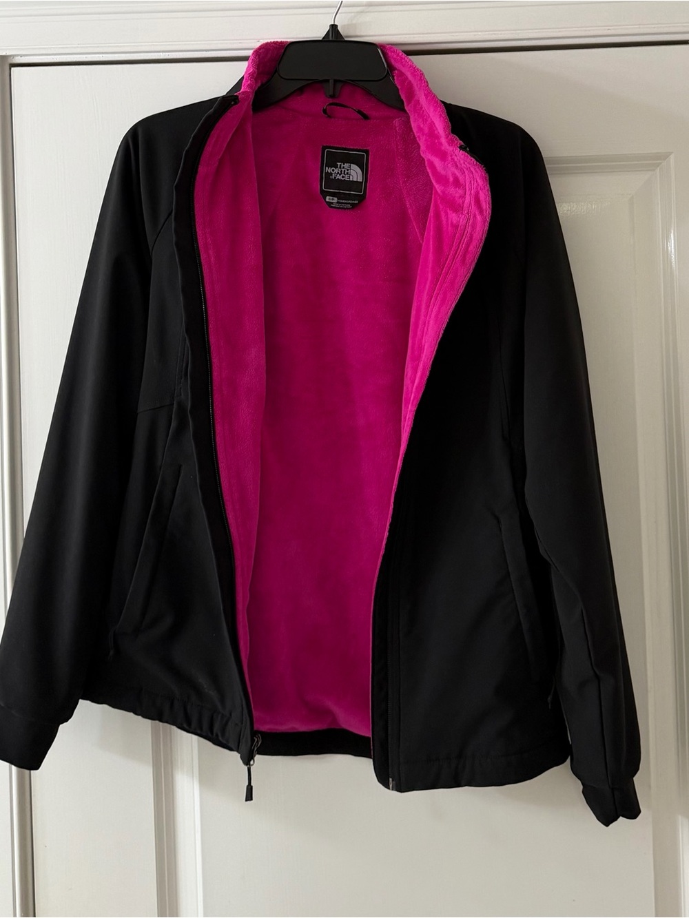 The North Face Women’s Black Jacket with Bright Pink Fleece Lining